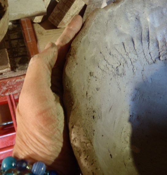 Support with 1 hand on outside. Gently move clay in many directions to get that coil right where you want it. Inside first, of course.